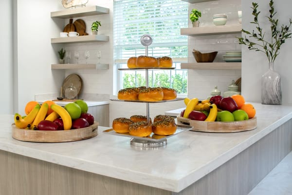 Display of fresh fruits and pastries in a kitchen