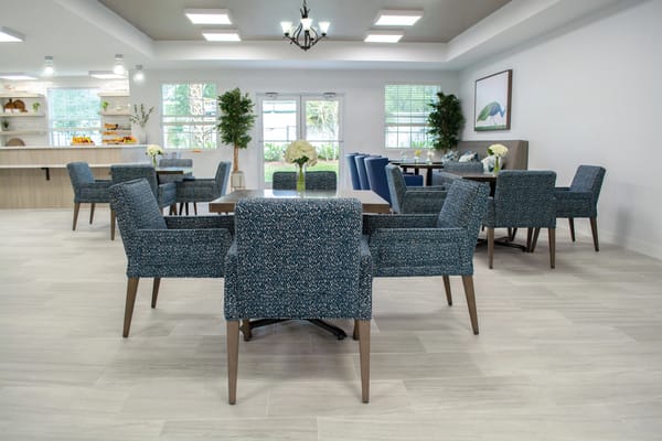 Bright common area with tables and seating