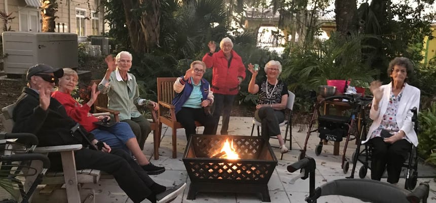 Residents gathered around a fire pit outdoors