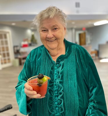 Resident enjoying a cocktail in the common area