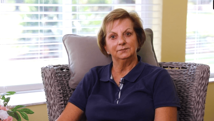 Resident seated in an interior space