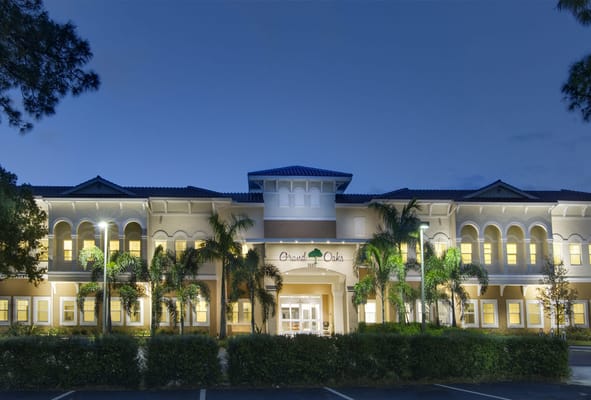 Exterior view of Grand Oaks facility at twilight