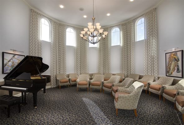 Interior common area with seating and a piano