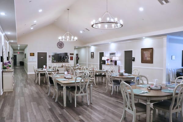 Bright dining room setup with tables and chairs