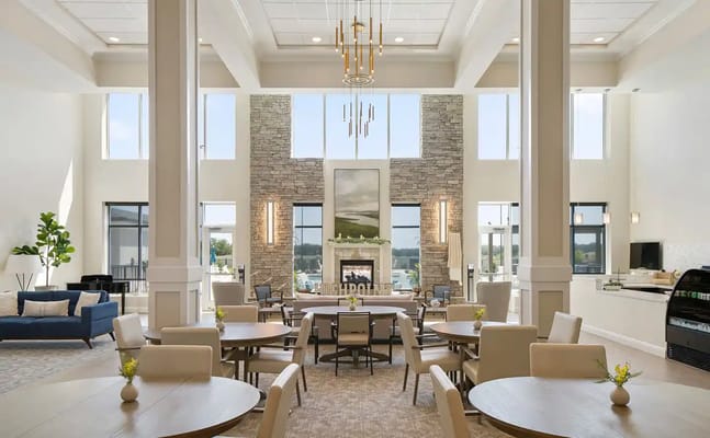 Spacious common area with seating and a fireplace