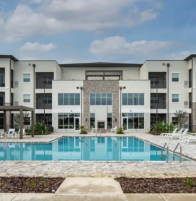 Exterior view of a modern facility with a pool