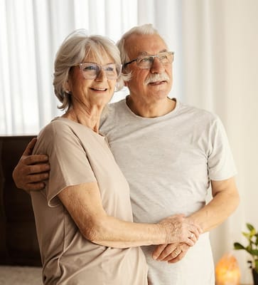 A senior couple smiling together indoors