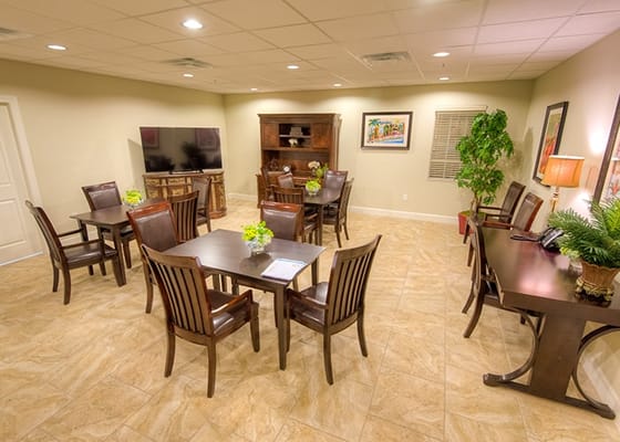 Bright and inviting common area with tables and chairs