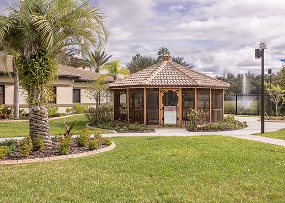 Outdoor gazebo surrounded by gardens