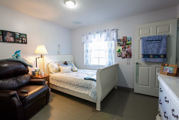Cozy resident room with bed and seating area