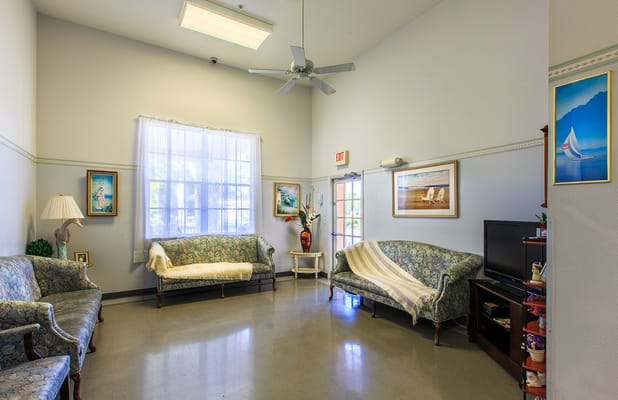 Bright common area with seating and artwork