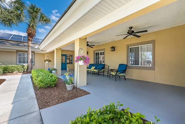 Outdoor seating area with potted plants