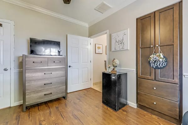 A cozy resident room with furniture and decor