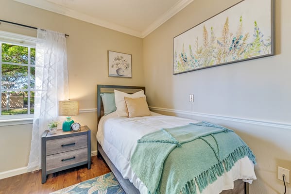 Cozy private resident room with a bed and decorations