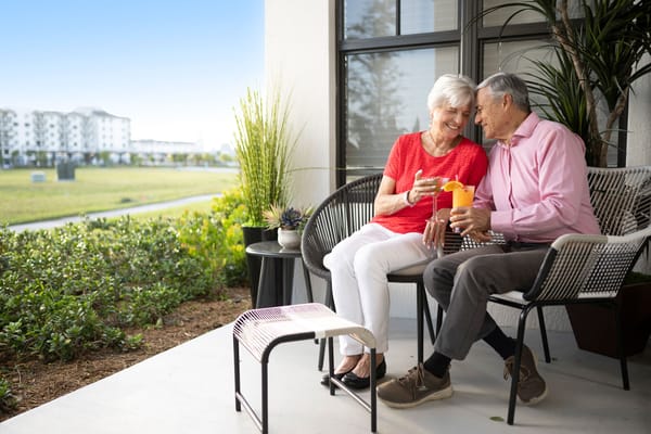 Couple enjoying drinks on a patio