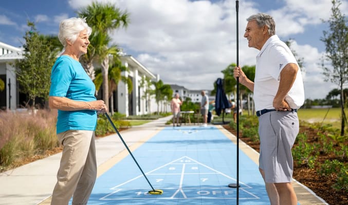 Residents enjoying a game of shuffleboard outside