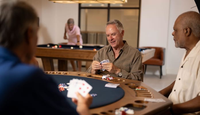Residents playing cards in a common area