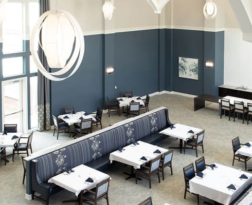 Bright dining room with elegant decor and table settings