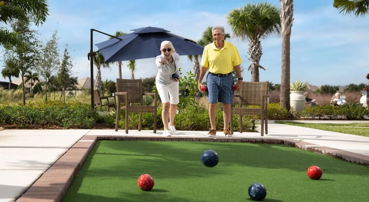 Residents enjoying outdoor bocce ball game