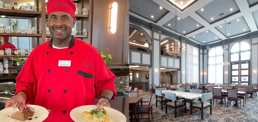 Chef presenting dishes in a well-lit dining area