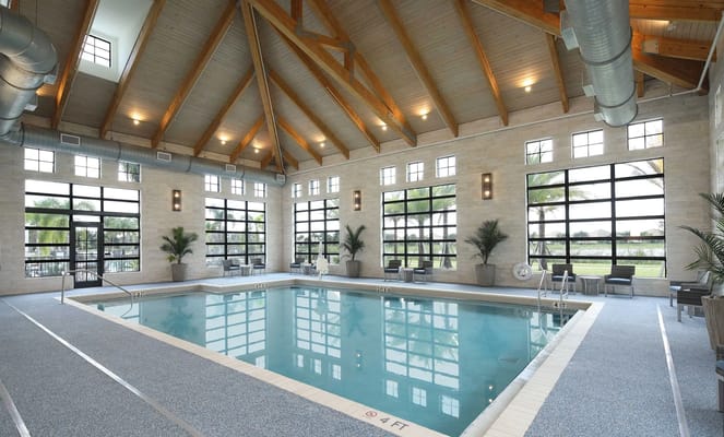 Indoor swimming pool area with large windows