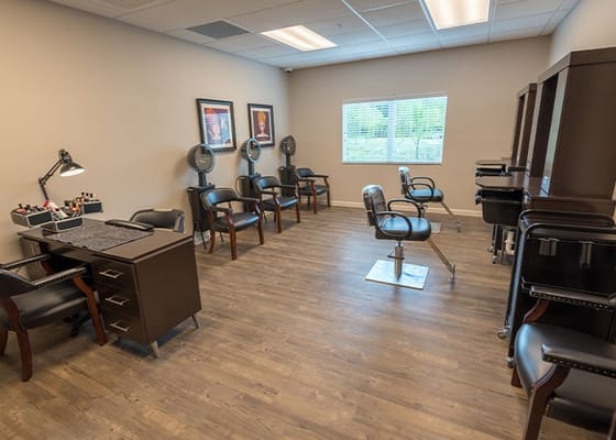 Interior of a salon area with styling chairs and equipment
