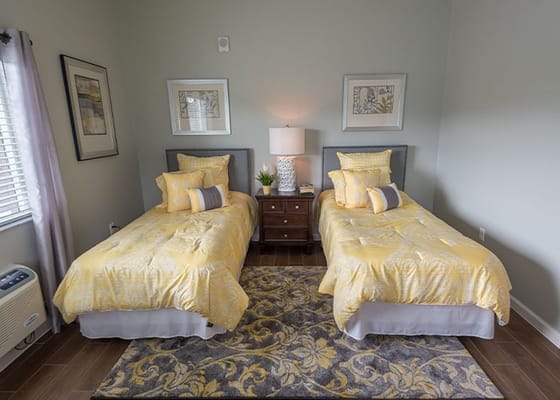 Well-decorated resident room with two beds