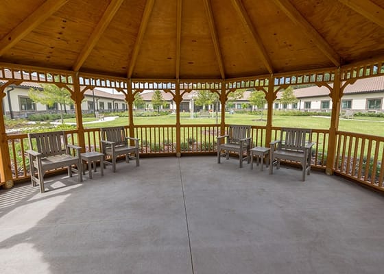 Outdoor gazebo with seating area in the garden