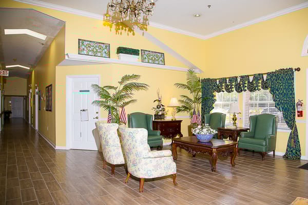 Brightly decorated common area with seating and plants