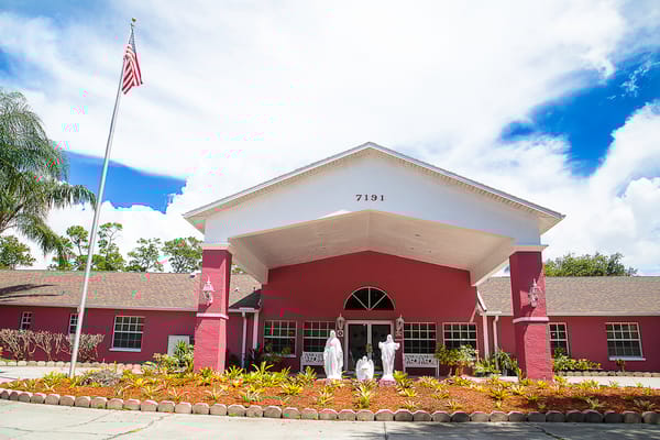 Exterior view of a nursing home with landscaping