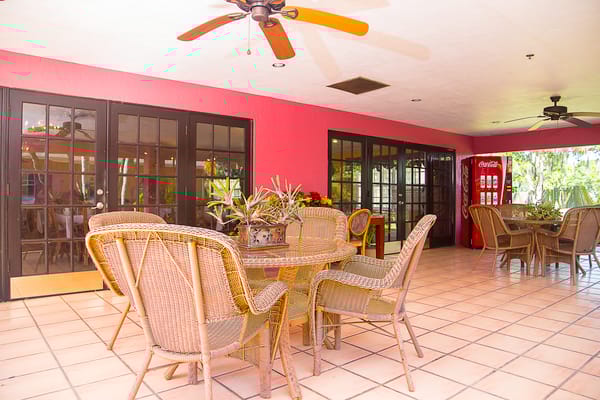 Bright common area with seating and a vending machine