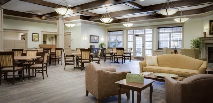 Bright common area with seating and tables