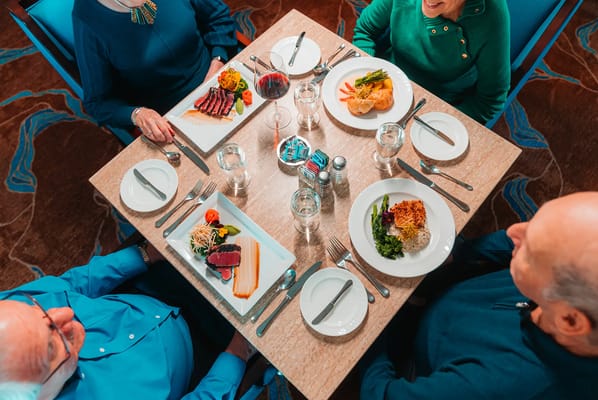 Residents enjoying a meal in the dining room
