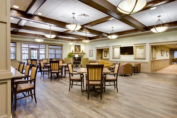 Bright common area with seating and tables