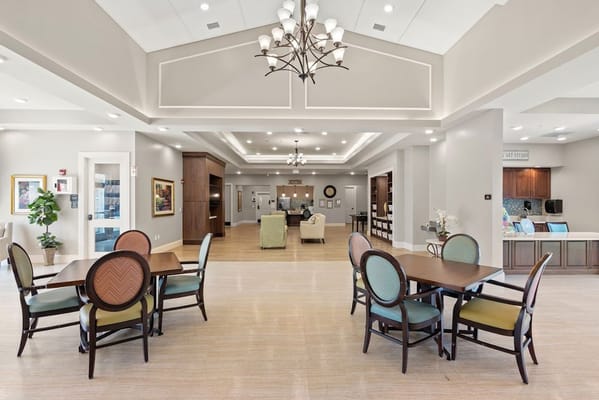 Bright common area with tables and chairs
