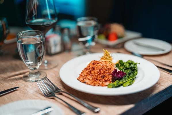 A beautifully plated fish meal with vegetables