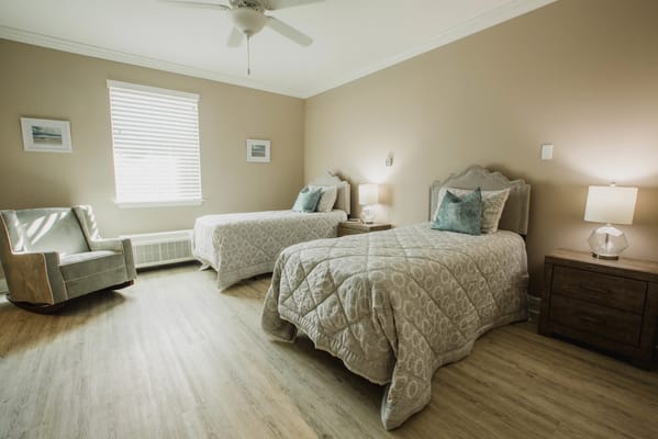 A cozy shared resident room with two beds