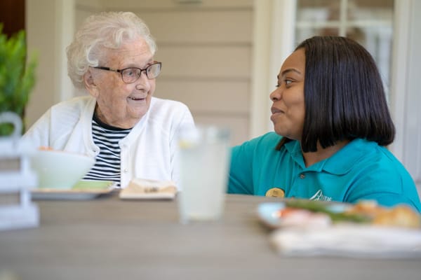 Staff member engaging with a resident outdoors
