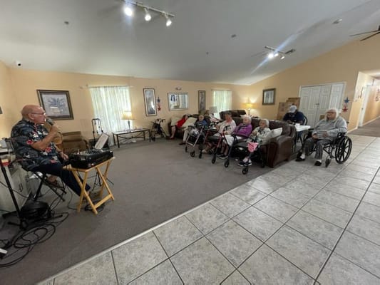 Residents enjoying a music performance in a common area