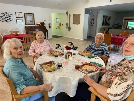 Residents enjoying a meal in a dining area