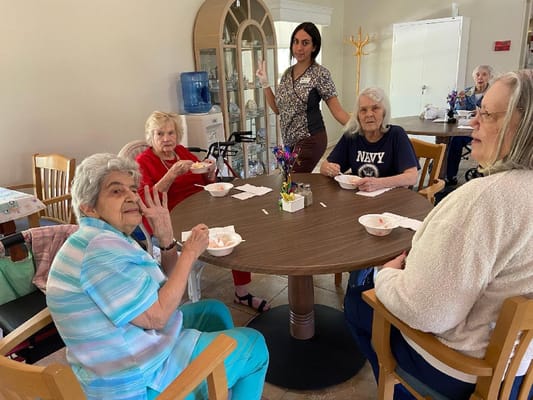 Residents enjoying ice cream in a common area