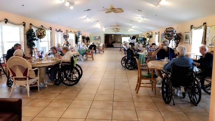 Residents enjoying a meal in the dining room