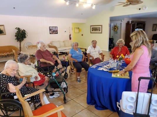 Residents engaged in an activity with a staff member