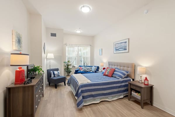 Cozy interior of a resident room with a bed and decor