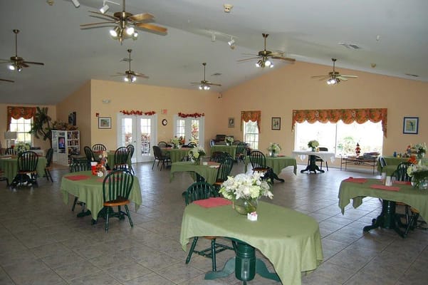 Dining area with tables and floral decorations