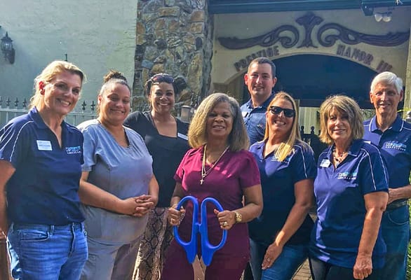 Staff and residents posing outside Prestige Manor