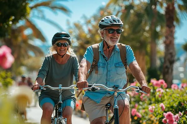 Seniors biking together in a vibrant outdoor garden