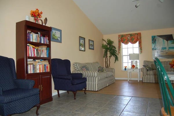 Cozy living area with seating and bookshelves