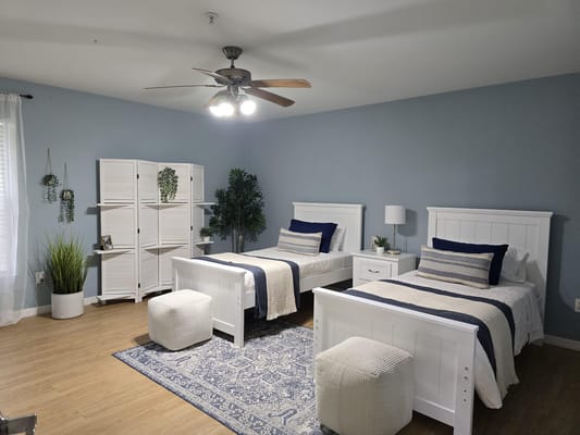 A shared room with two beds and decor