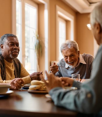 Residents enjoying a meal together in a dining area